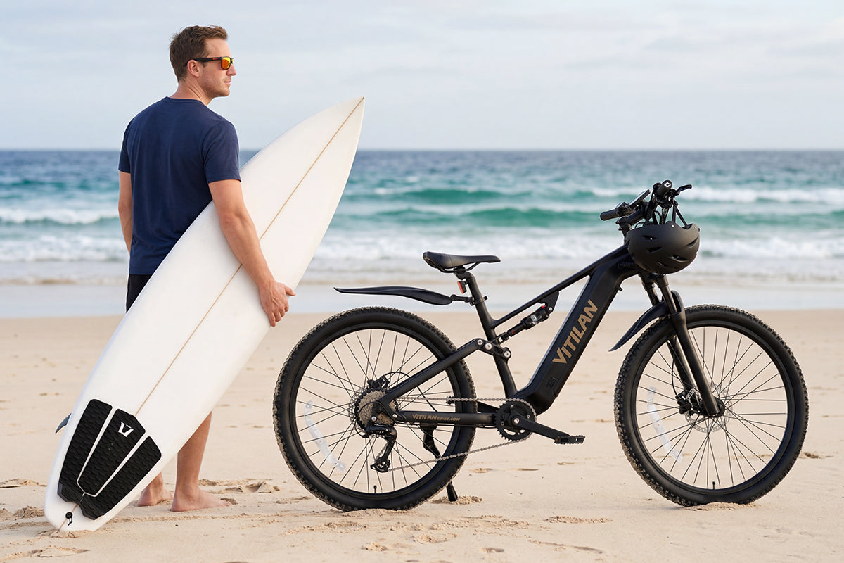 Vitilan M5 black e-bike lifestyle beach image