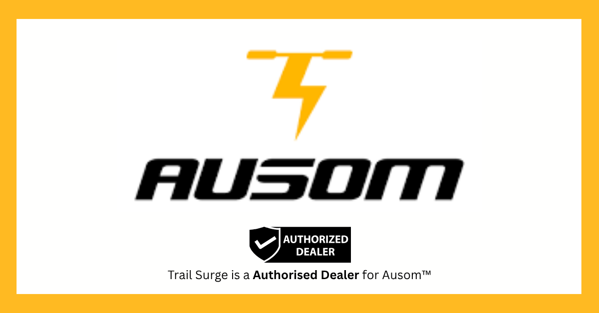 Logo with a yellow electric scooter and lightning bolt symbol above the word “AUSOM”; below is a black badge labeled AUTHORIZED DEALER and the text, Trail Surge is a Authorised Dealer for Ausom™.