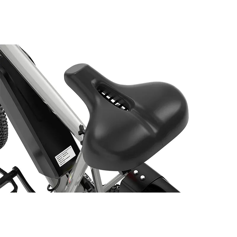 Close-up of a black, wide, padded bicycle seat with a center cut-out, mounted on a silver bike frame. The seat looks ergonomic and is attached above the battery compartment.