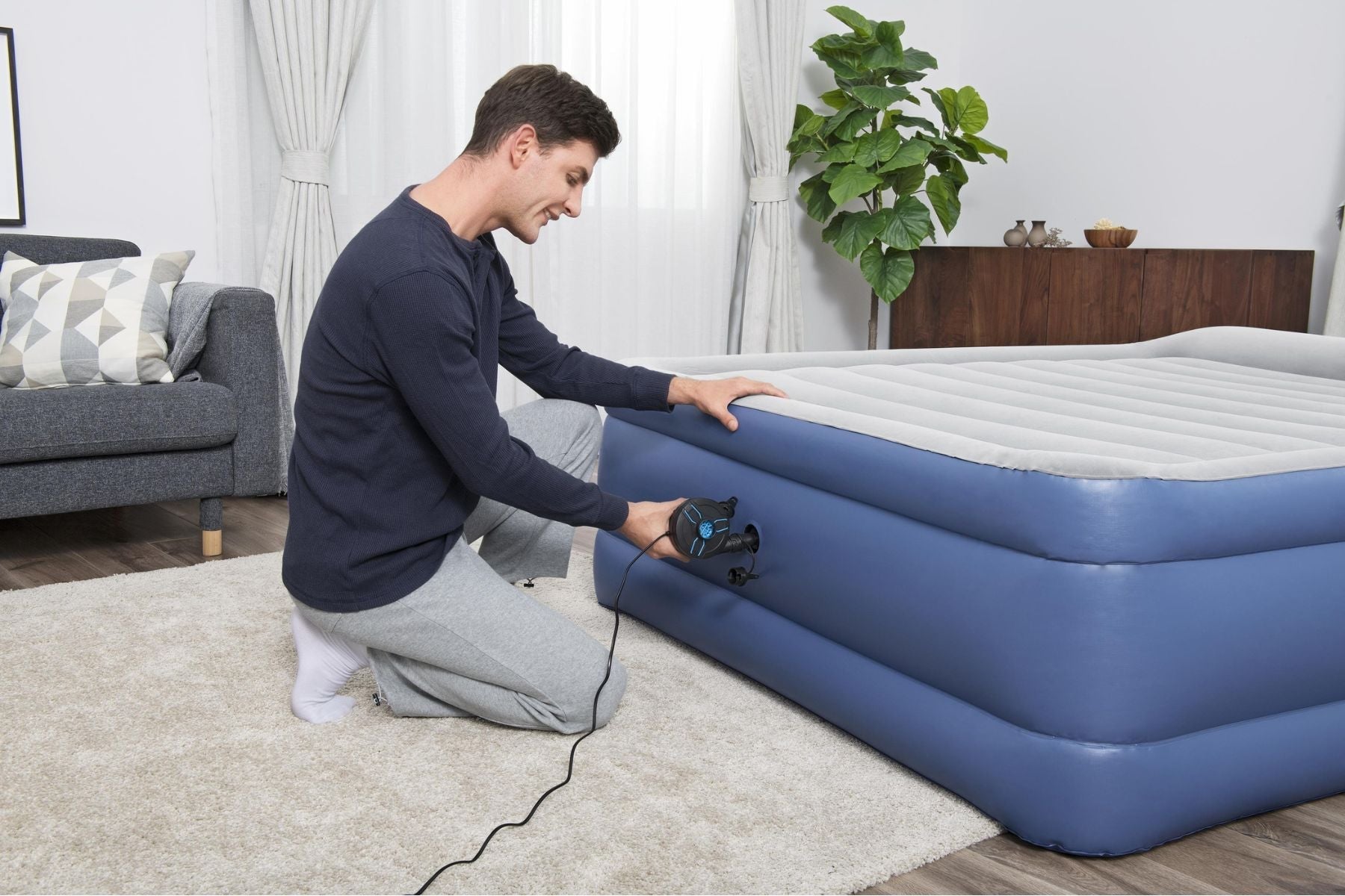 Bestway PowerTouch AC Electric Air Pump inflating an airbed