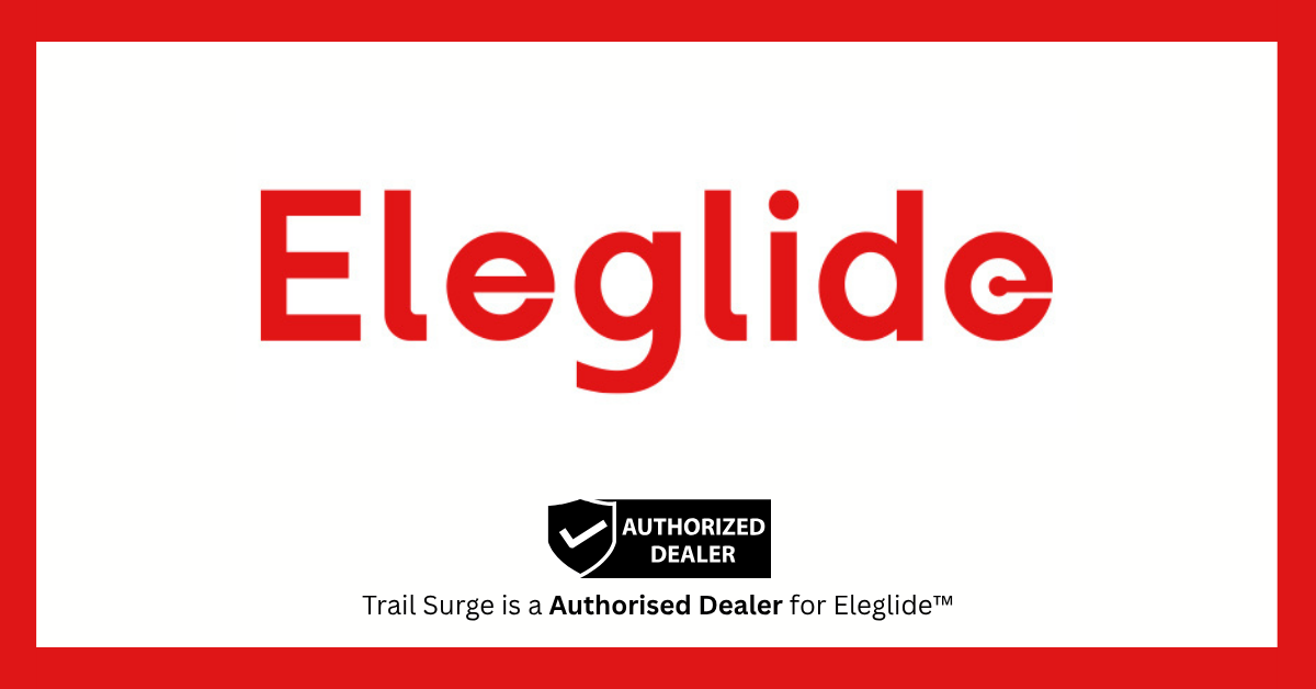 The image features the word Eleglide in large red text, with a badge below stating Authorized Dealer. Underneath, it reads, Trail Surge is a Authorised Dealer for Eleglide™. The background is white with a red border.