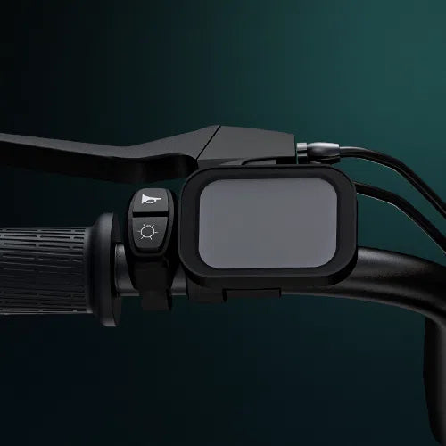 Close-up of an electric bicycle handlebar, showing a textured rubber grip, a display screen, and buttons for a horn and headlight, set against a dark green background.