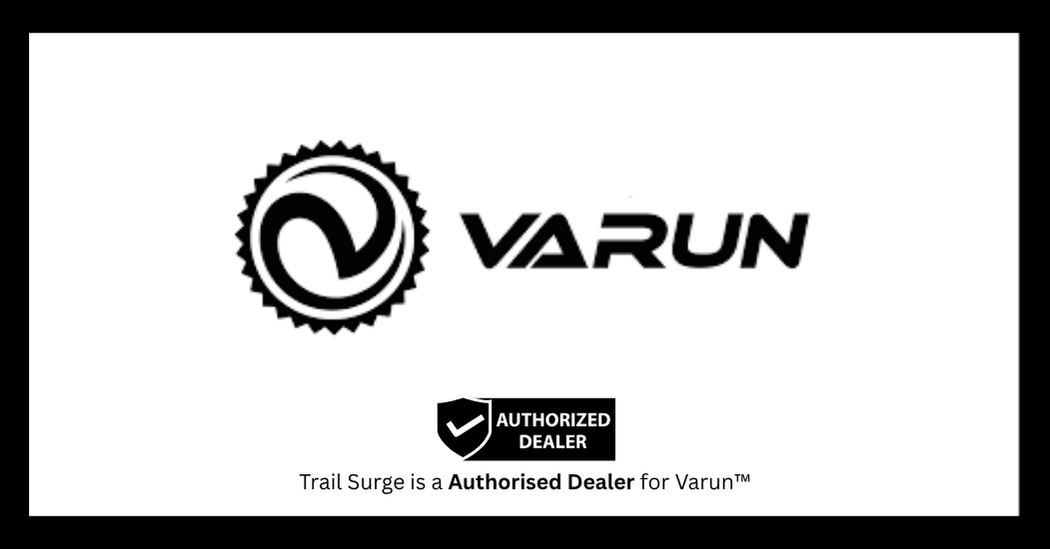 Varun logo with a circular gear design and stylized “V,” followed by the word VARUN. Below, a badge reads Authorized Dealer, and text states, Trail Surge is a Authorised Dealer for Varun™.