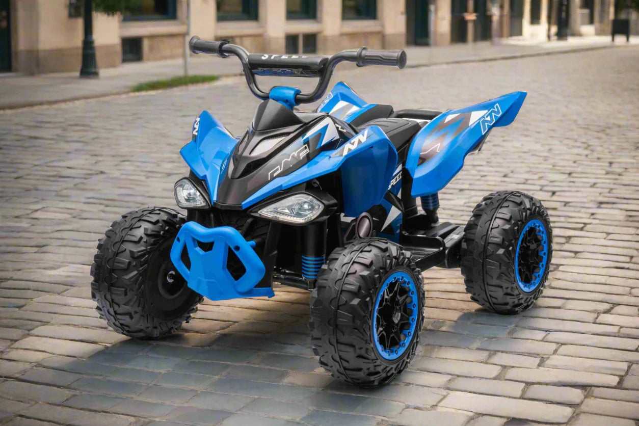Blue and black youth electric ATV with rugged tires parked on a cobblestone street in daylight
