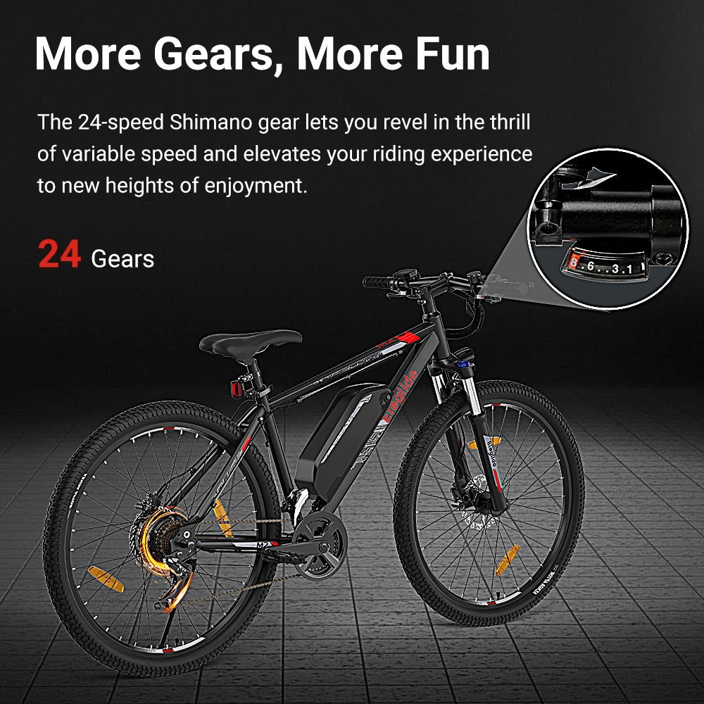 A black mountain bike with red accents is shown on a gray grid floor. Text highlights its 24-speed Shimano gear system, with a close-up inset of the gear indicator. Bold text reads: More Gears, More Fun. 24 Gears.