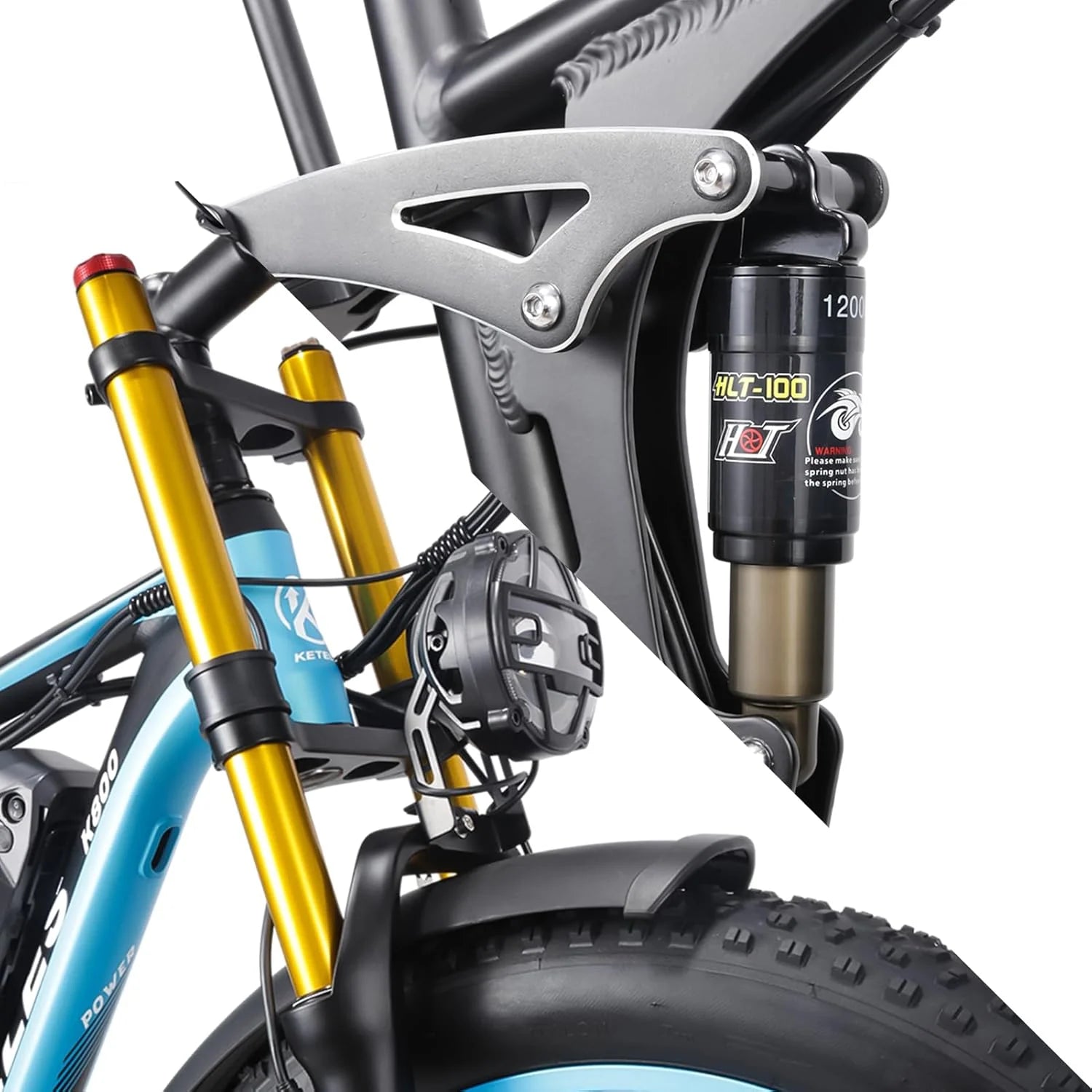 Close-up of a mountain bikes front suspension fork and rear shock absorber, highlighting metal brackets, shock components, and part of the blue bike frame with a black tire underneath.