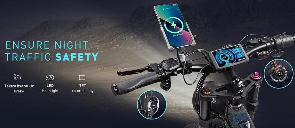 Close-up of bike handlebars equipped with phone mounts, TFT color display, hydraulic brake, and LED headlight controls at night.