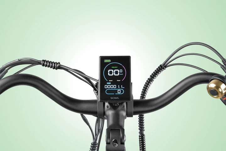 Close-up view of an e-bike handlebar featuring a digital display screen with speed and battery indicators, coiled wires, a bell, and a pastel green background.