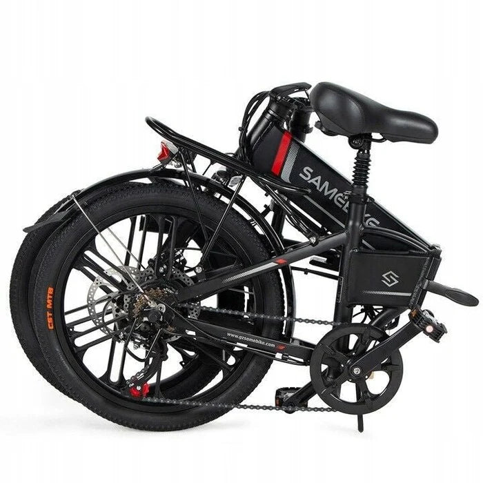 A black folding electric bicycle is shown in its folded position, with both wheels compactly aligned and the pedal tucked in. The frame has the brand name Samebike visible.